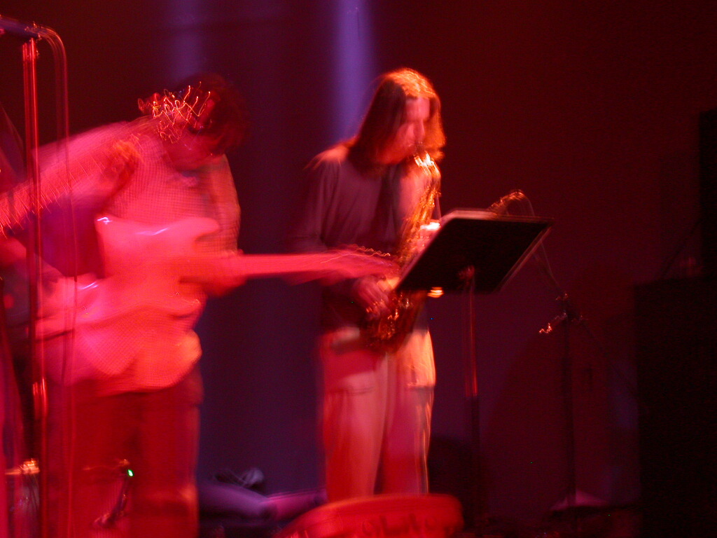 Dan Magay, saxophone under red stage light